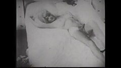 Busty pornstar in black lingerie caresses her wet pussy in 60s erotic movie Thumb